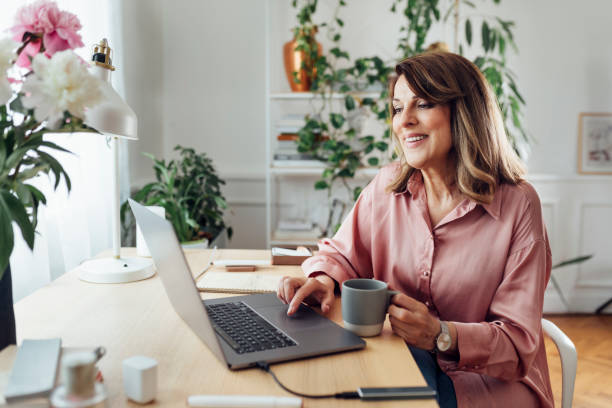 Woman writing a blog at her laptop.