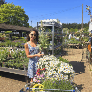 Danyel is in a garden centre enjoying her new plants.