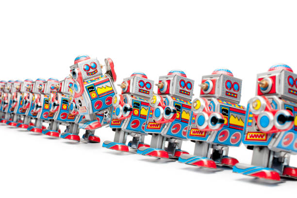 Retro tin robots marching in a row. One robot is jumping.